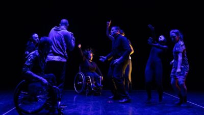 Panoramic view of the performers of 'Do Robots have emotions?' performing on the stage